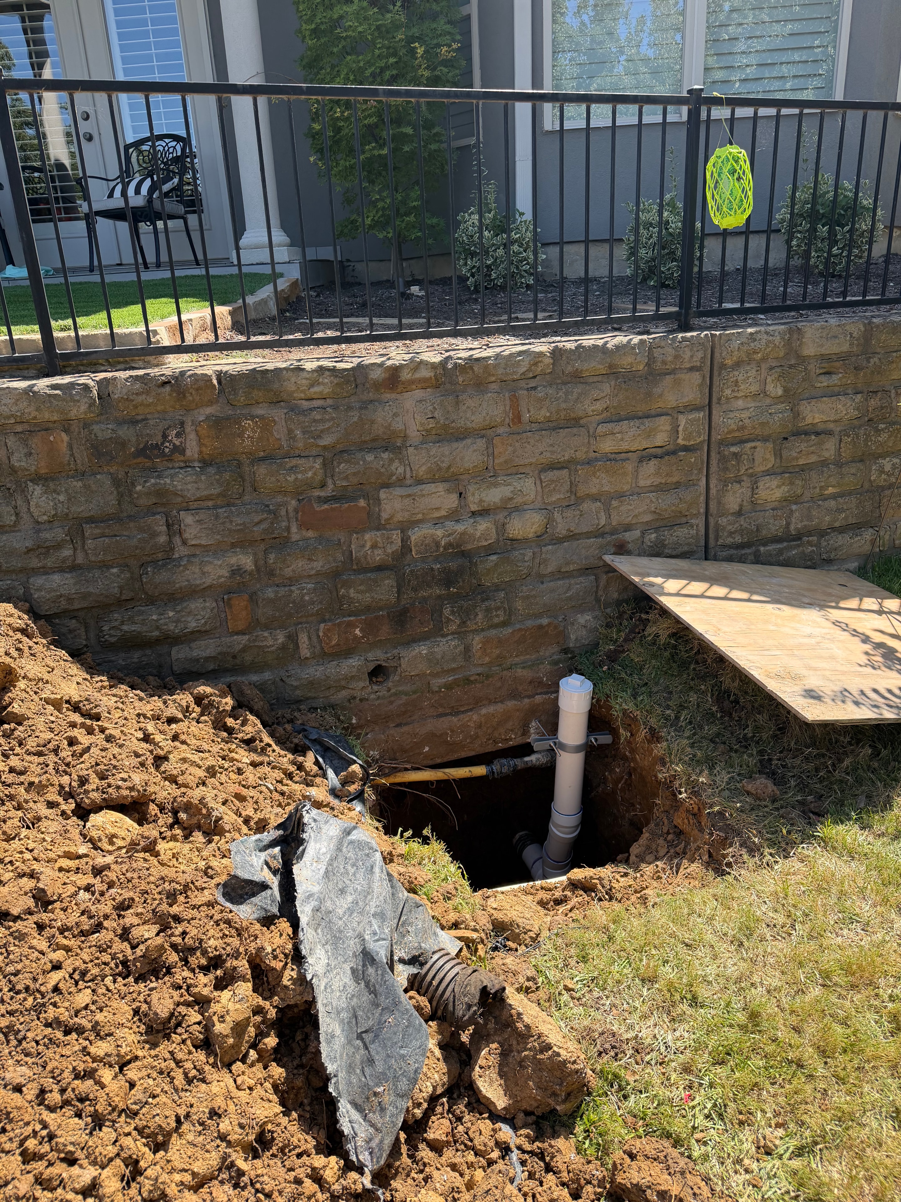 Backyard excavation for drainage pipe