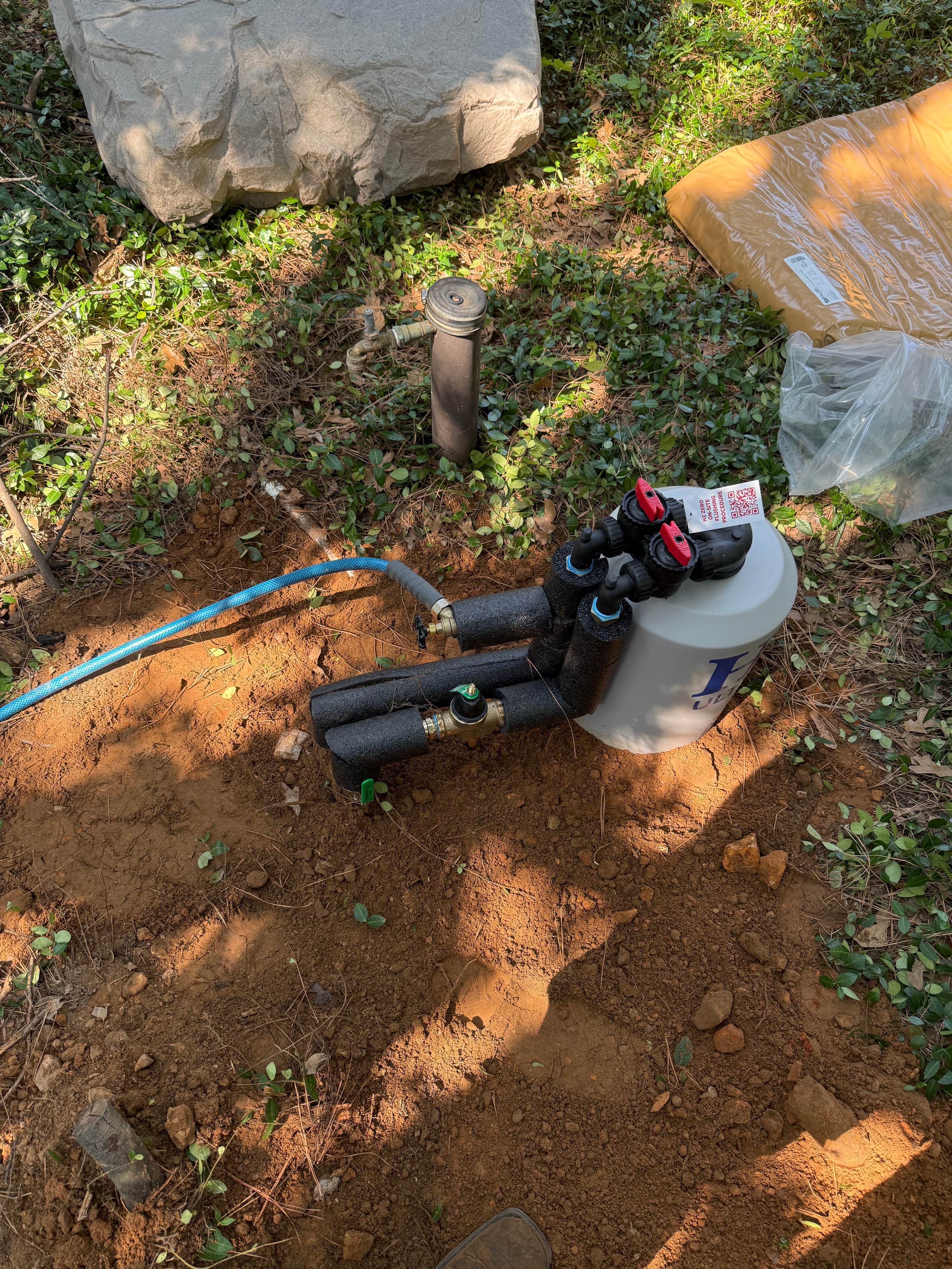 Water softener with pressure reducing valve