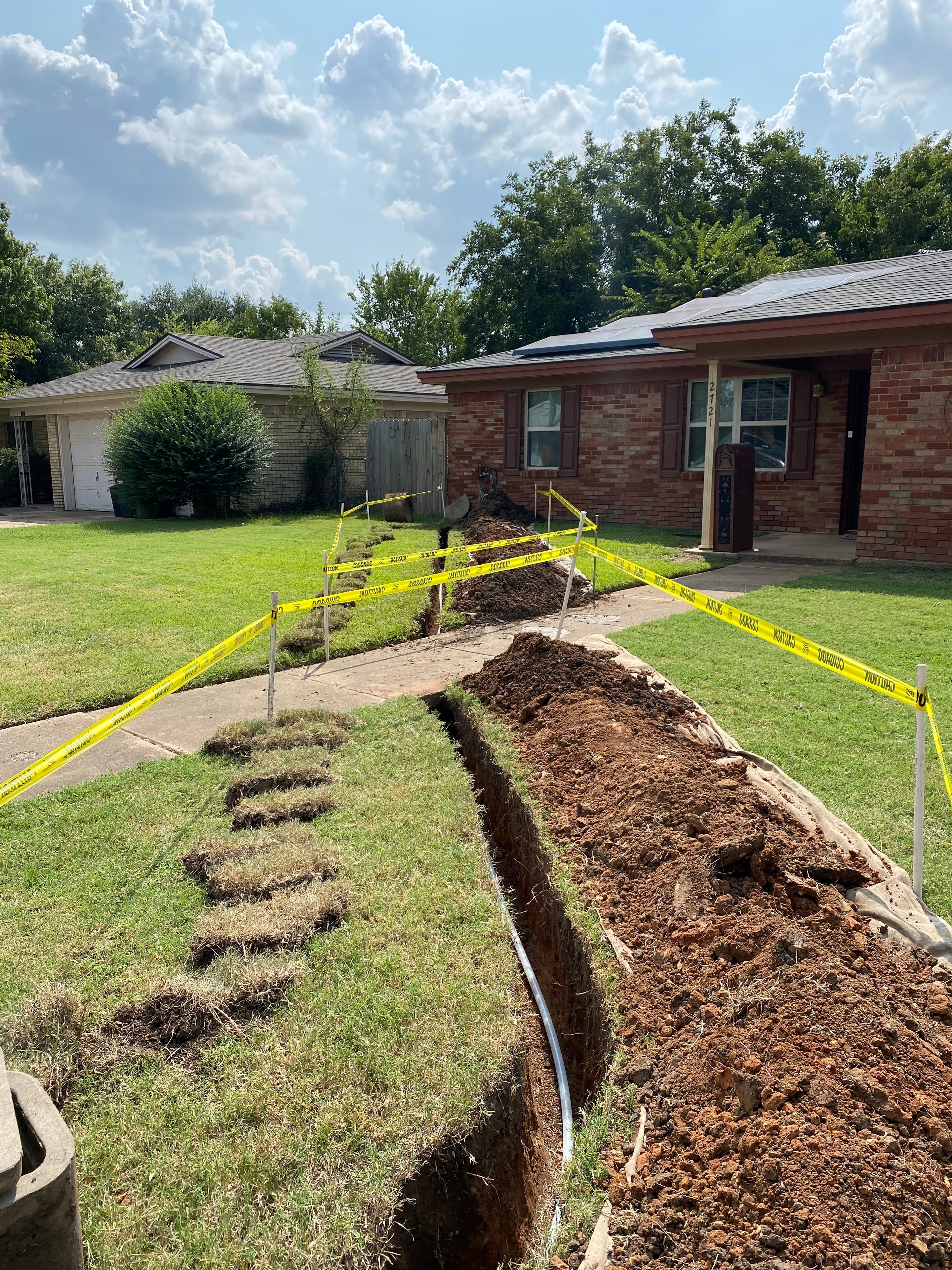 Residential yard excavation for water line